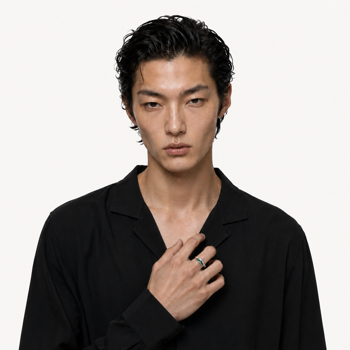 Model in a black shirt wearing sculptural Relic rings