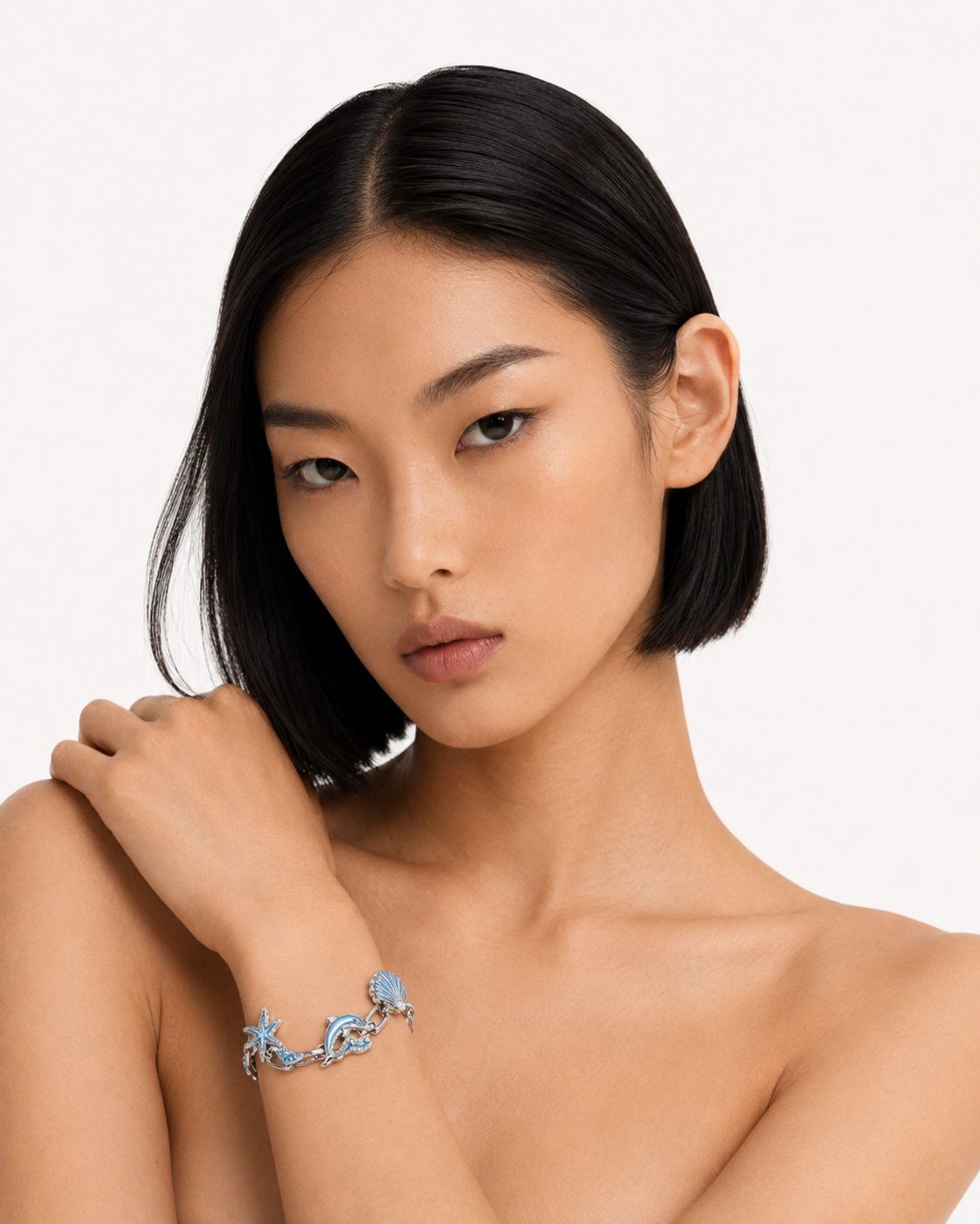 Model wearing the Sacred Pool Bracelet in a clean studio portrait